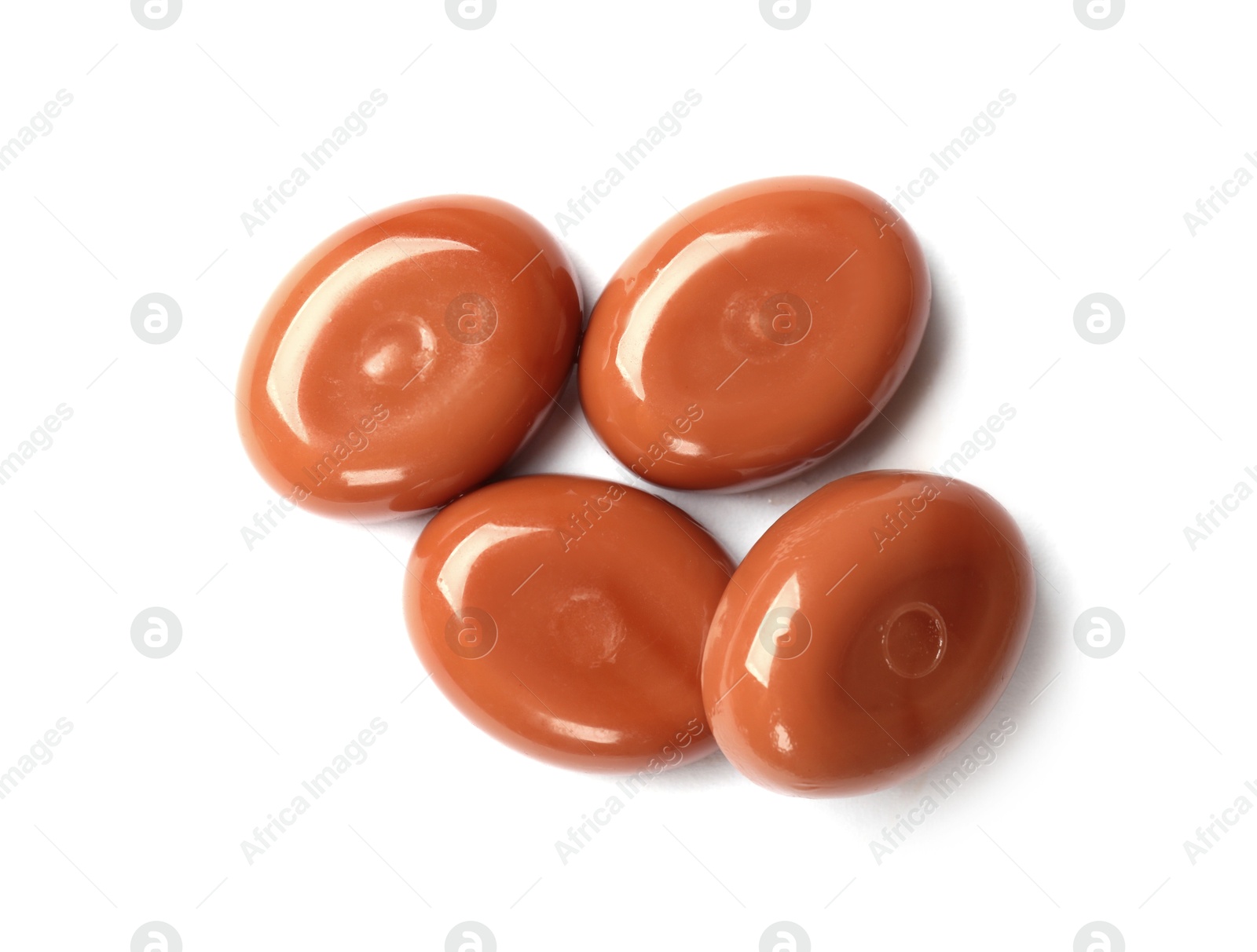 Tasty sweet caramel candies isolated on white, top view Photo of Tasty sweet caramel candies isolated on white, top view
