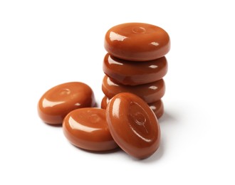 Photo of Tasty sweet caramel candies isolated on white