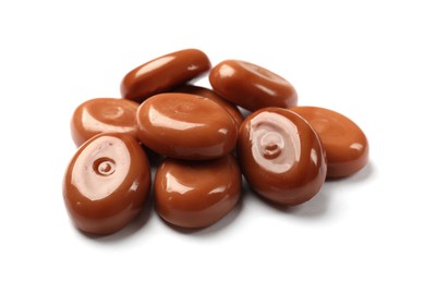 Photo of Tasty sweet caramel candies isolated on white