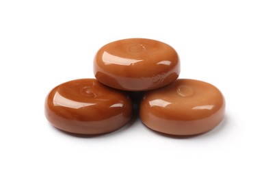 Photo of Tasty sweet caramel candies isolated on white