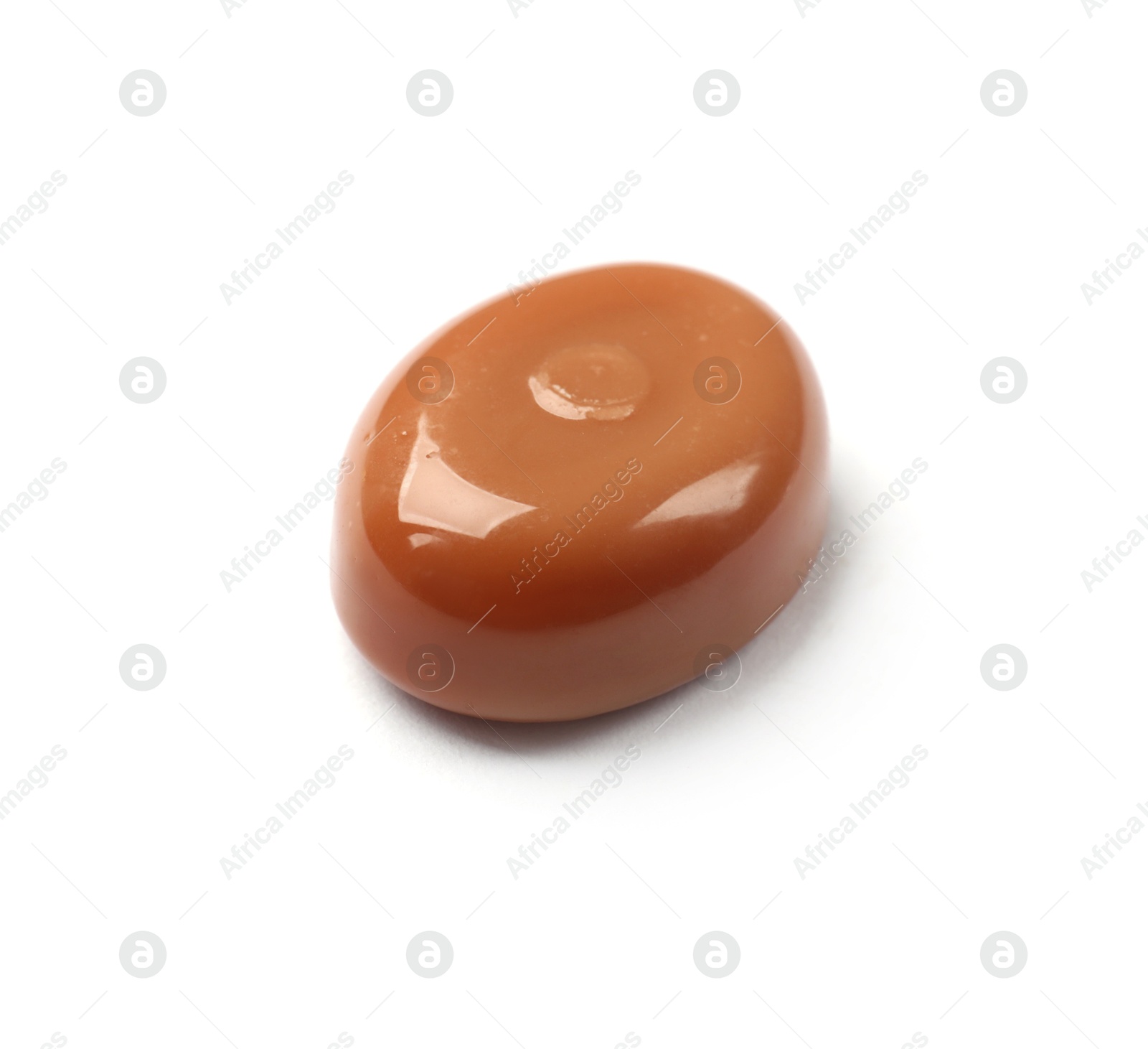 One tasty sweet caramel candy isolated on white Photo of One tasty sweet caramel candy isolated on white