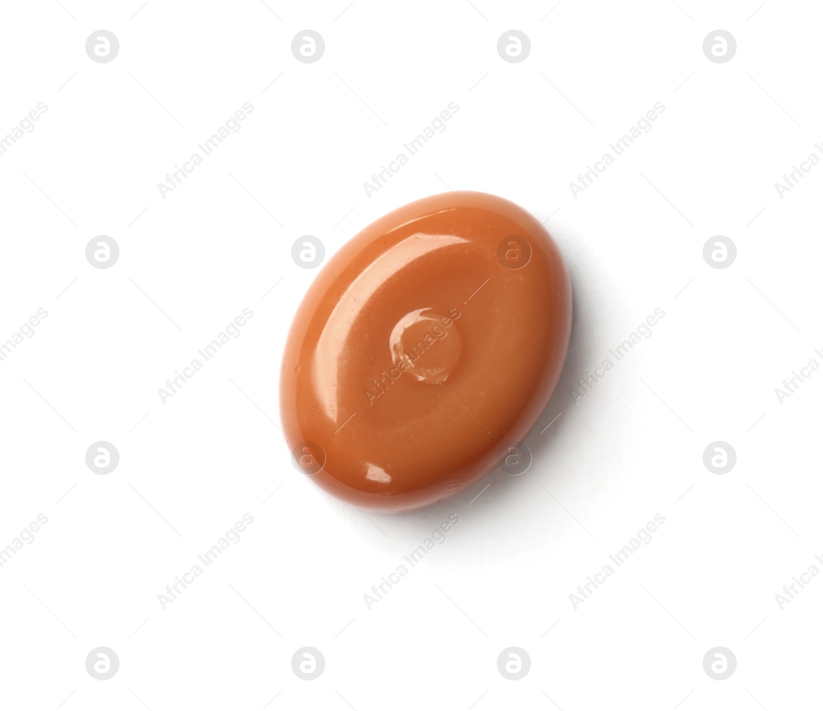Photo of One tasty sweet caramel candy isolated on white, top view