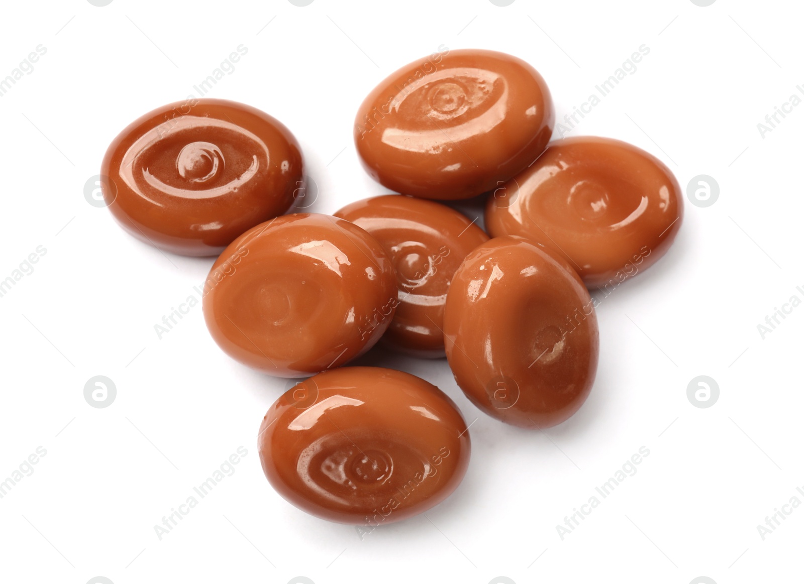 Tasty sweet caramel candies isolated on white, top view Photo of Tasty sweet caramel candies isolated on white, top view