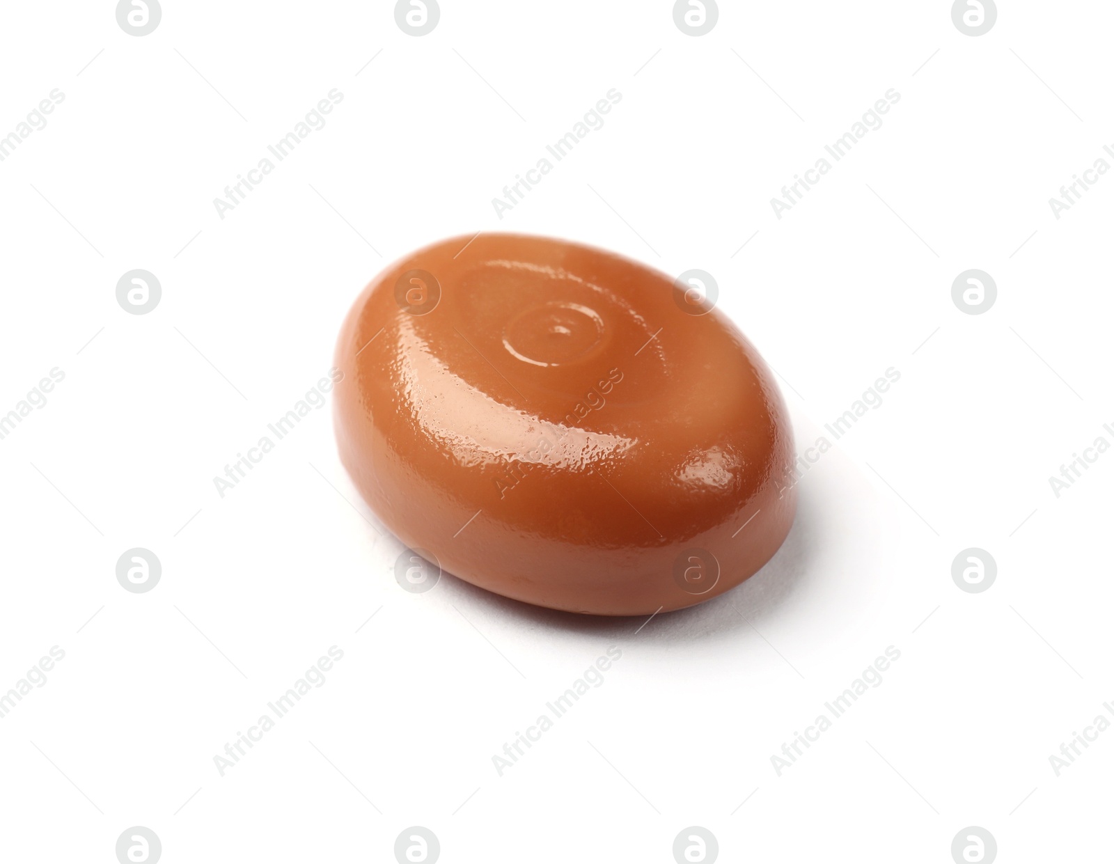 One tasty sweet caramel candy isolated on white Photo of One tasty sweet caramel candy isolated on white