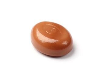 Photo of One tasty sweet caramel candy isolated on white