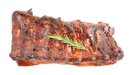 Photo of Tasty roasted pork ribs and rosemary isolated on white, top view