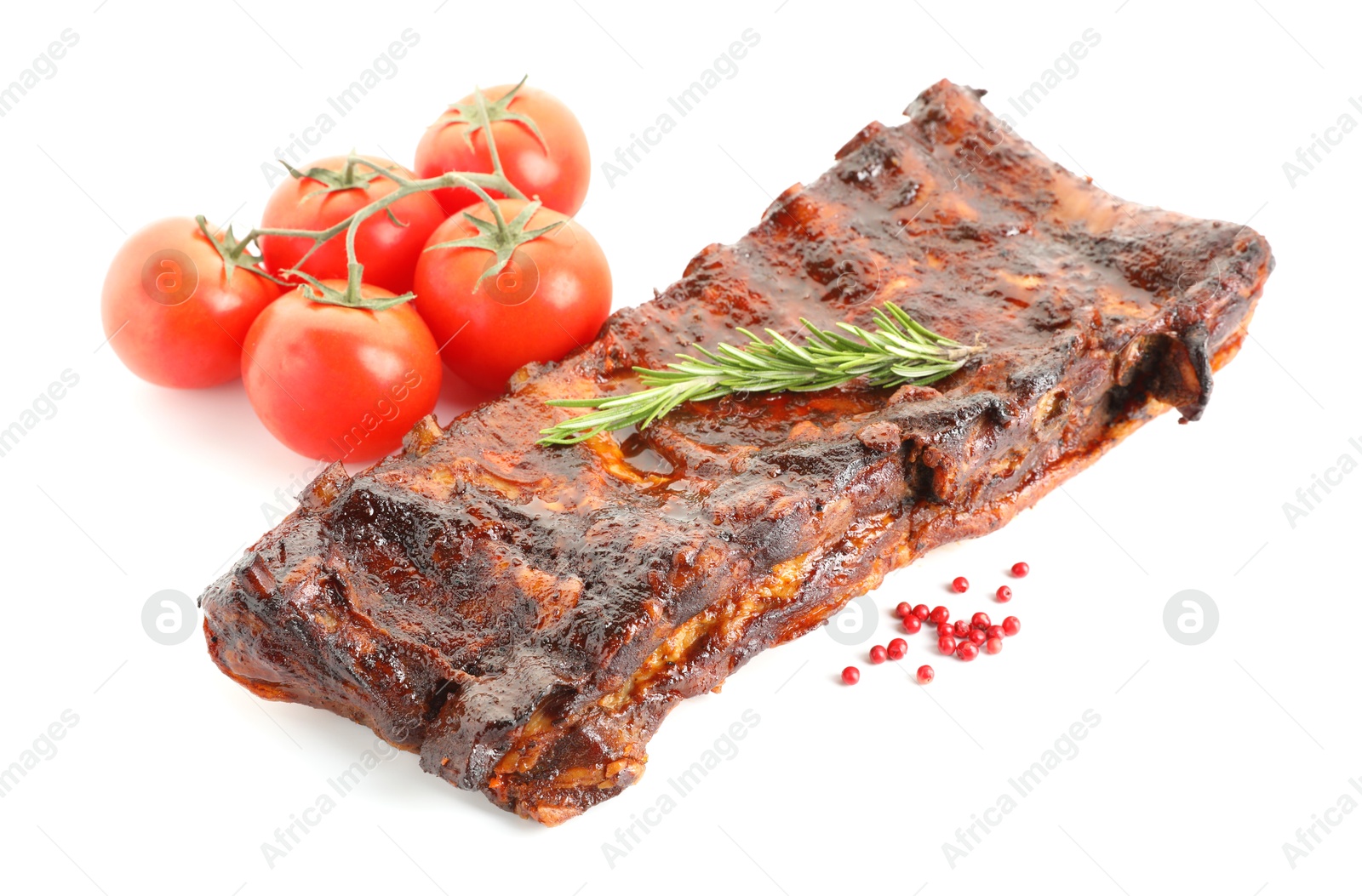 Tasty roasted pork ribs, tomatoes, spices and rosemary isolated on white Photo of Tasty roasted pork ribs, tomatoes, spices and rosemary isolated on white