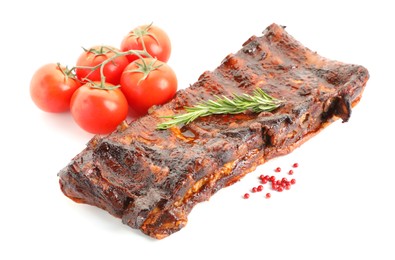 Photo of Tasty roasted pork ribs, tomatoes, spices and rosemary isolated on white