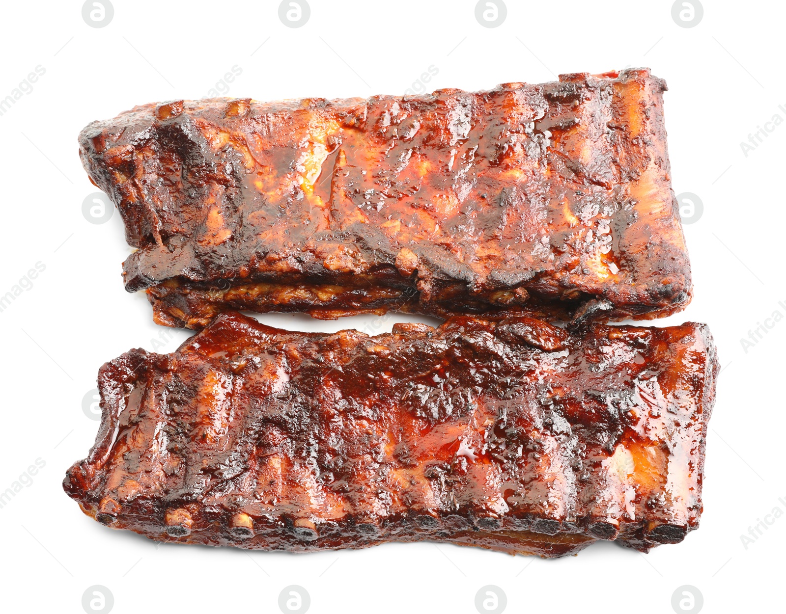 Tasty roasted pork ribs isolated on white, top view Photo of Tasty roasted pork ribs isolated on white, top view