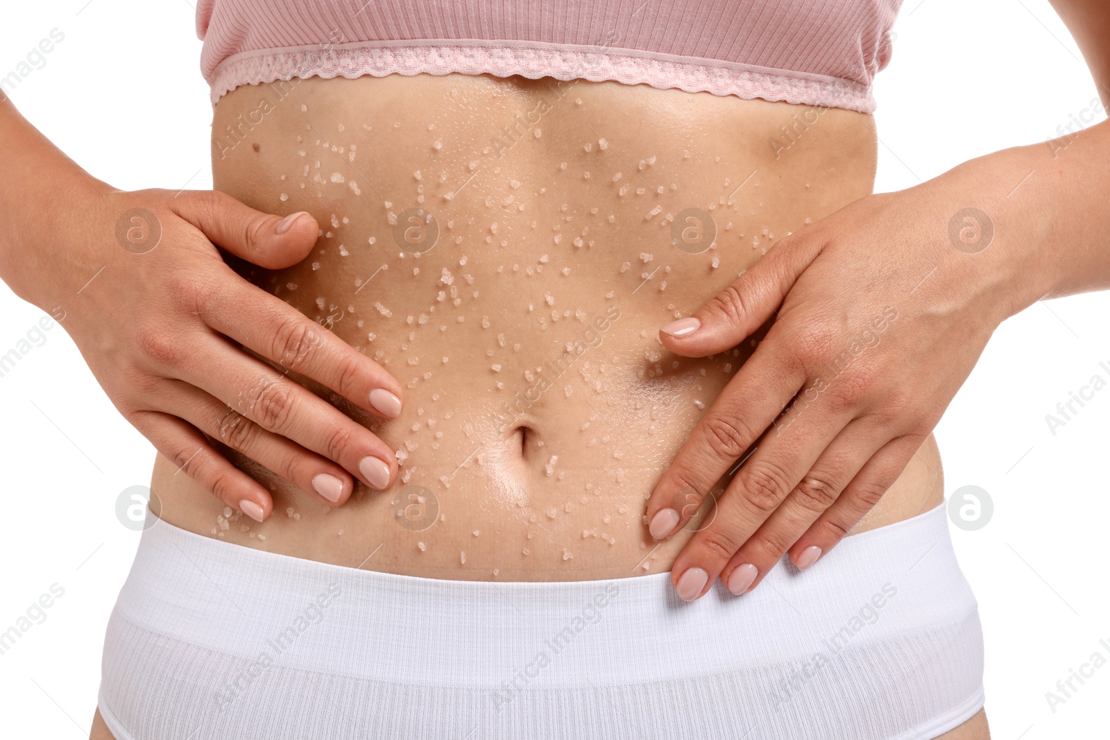 Woman applying body scrub onto her belly against white background, closeup Photo of Woman applying body scrub onto her belly against white background, closeup
