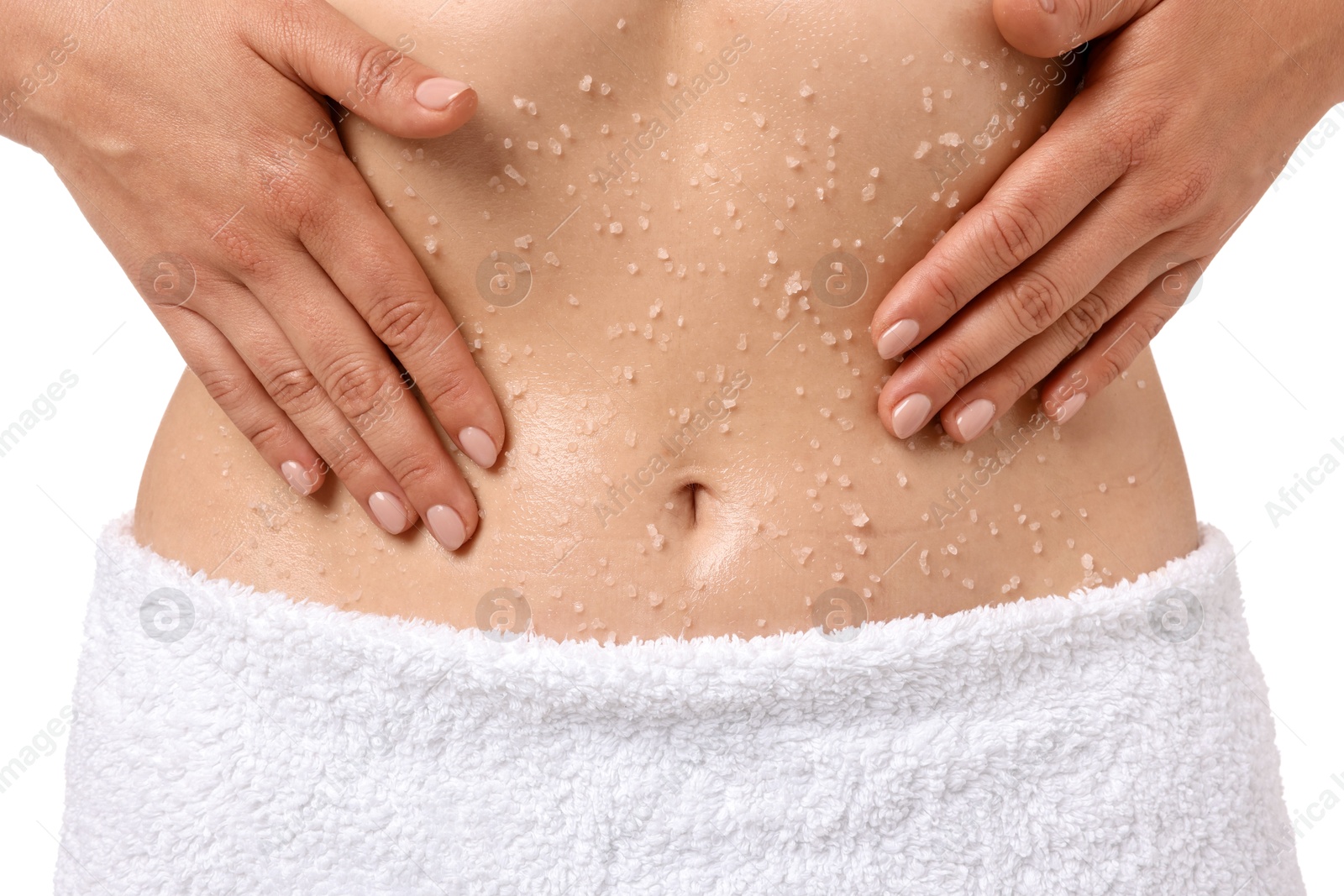 Woman applying body scrub onto her belly against white background, closeup Photo of Woman applying body scrub onto her belly against white background, closeup