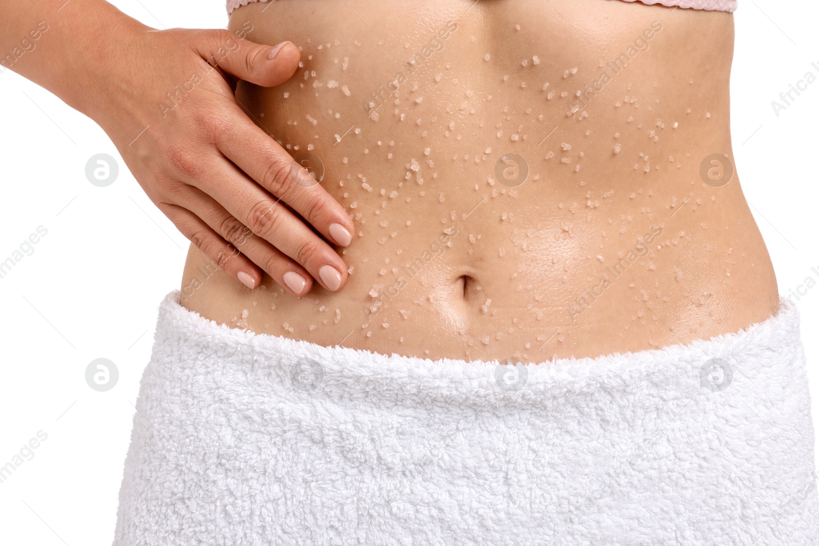 Woman applying body scrub onto her belly against white background, closeup Photo of Woman applying body scrub onto her belly against white background, closeup