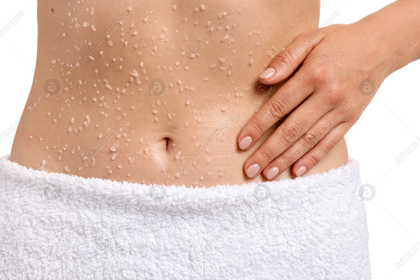 Woman applying body scrub onto her belly against white background, closeup Photo of Woman applying body scrub onto her belly against white background, closeup