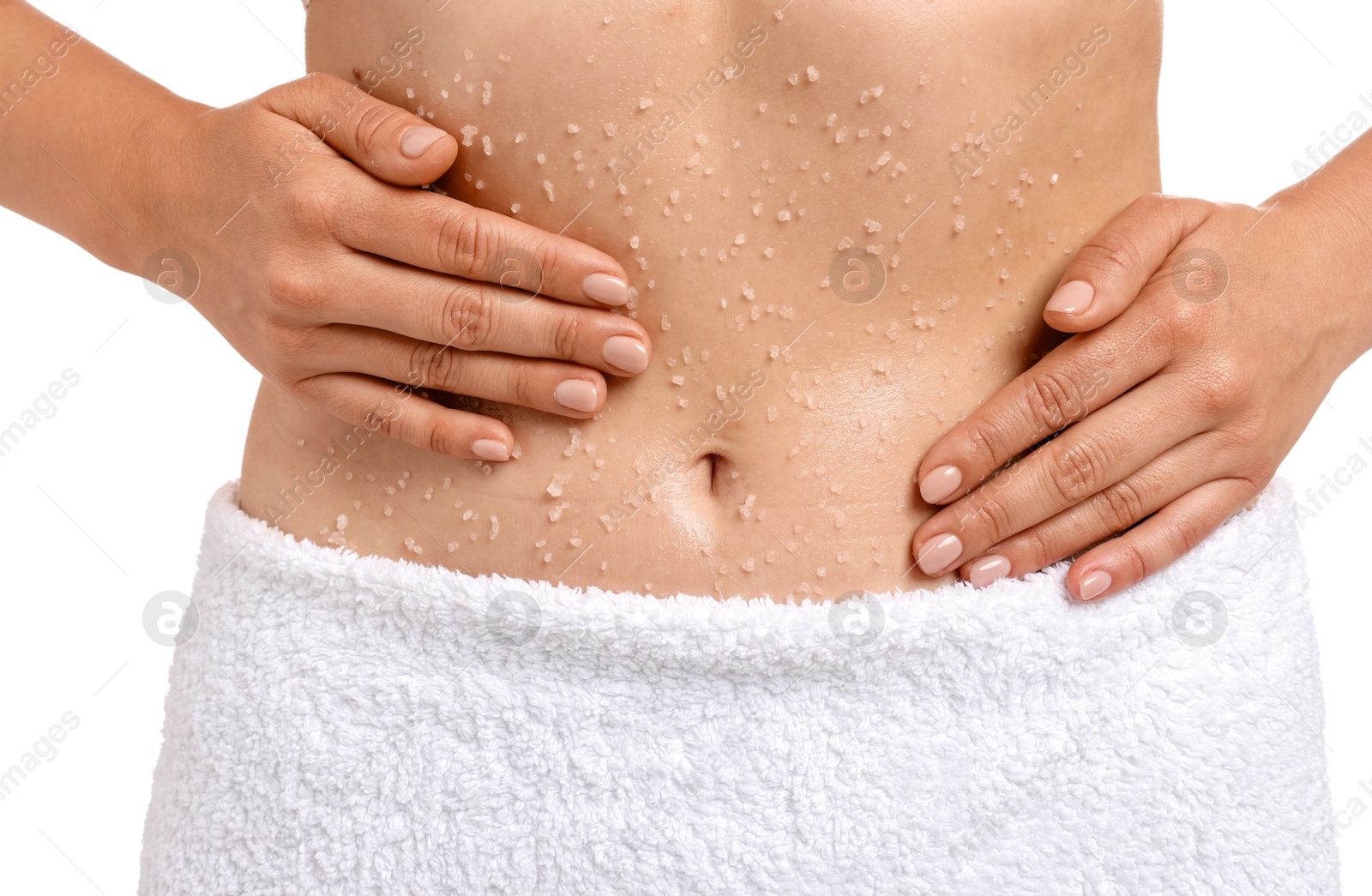 Woman applying body scrub onto her belly against white background, closeup Photo of Woman applying body scrub onto her belly against white background, closeup