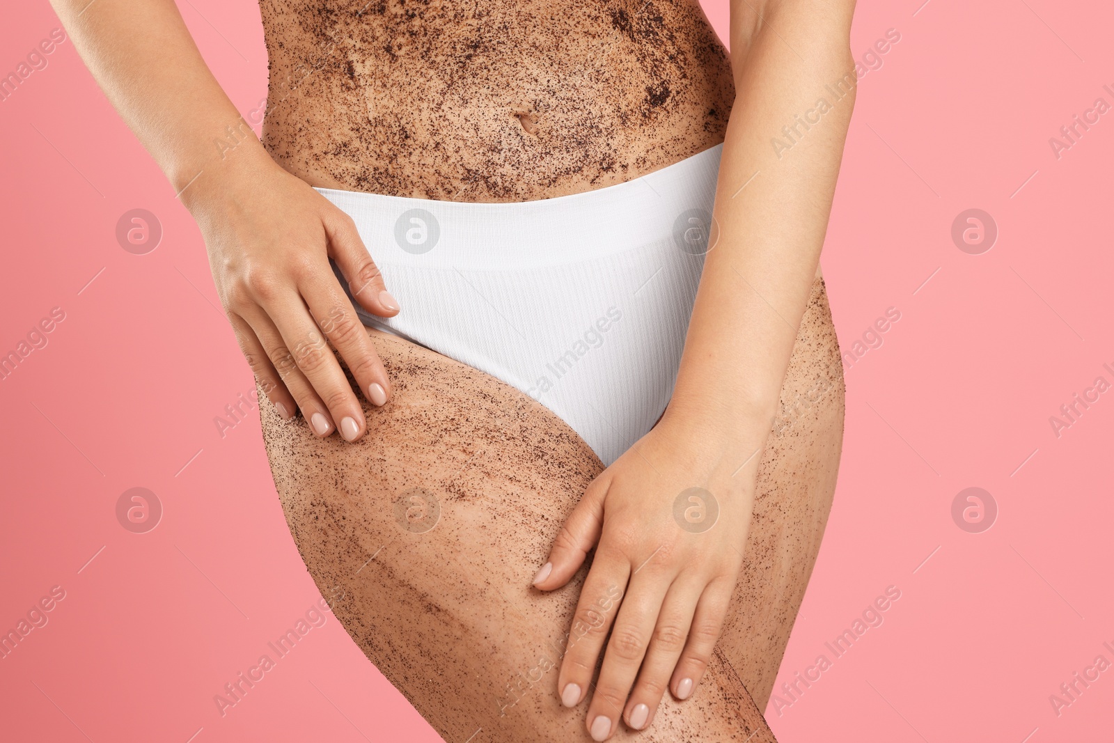 Woman with body scrub on her skin against pink background, closeup Photo of Woman with body scrub on her skin against pink background, closeup