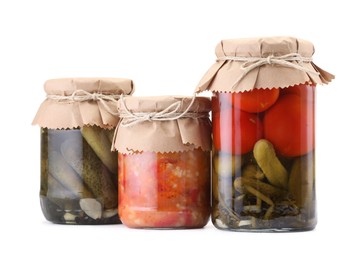 Photo of Many jars with different pickled products isolated on white