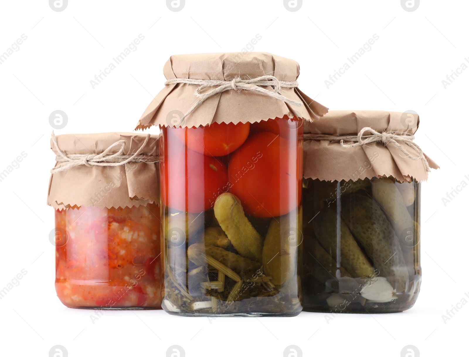 Jars with different pickled products isolated on white Photo of Jars with different pickled products isolated on white