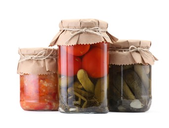 Photo of Jars with different pickled products isolated on white