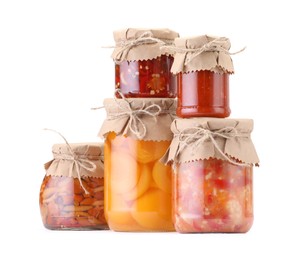 Photo of Many jars with different pickled products isolated on white