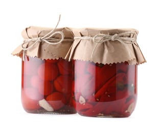Photo of Jars with different pickled products isolated on white