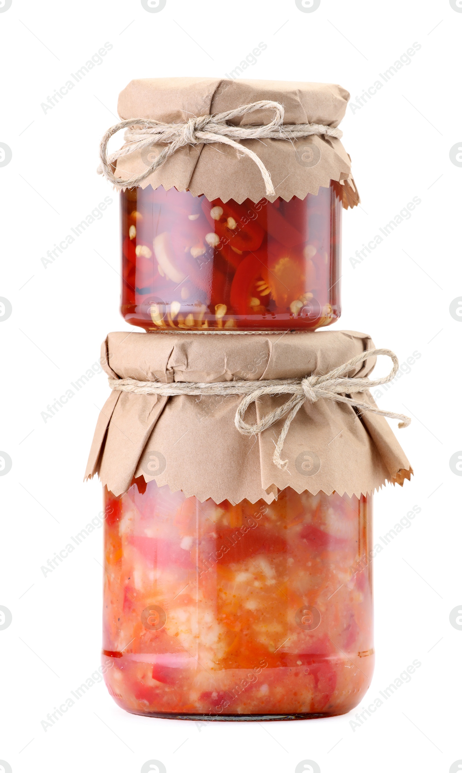 Jars with different pickled products isolated on white Photo of Jars with different pickled products isolated on white