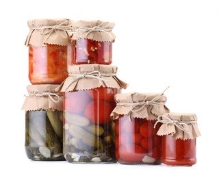 Photo of Many jars with different pickled products isolated on white