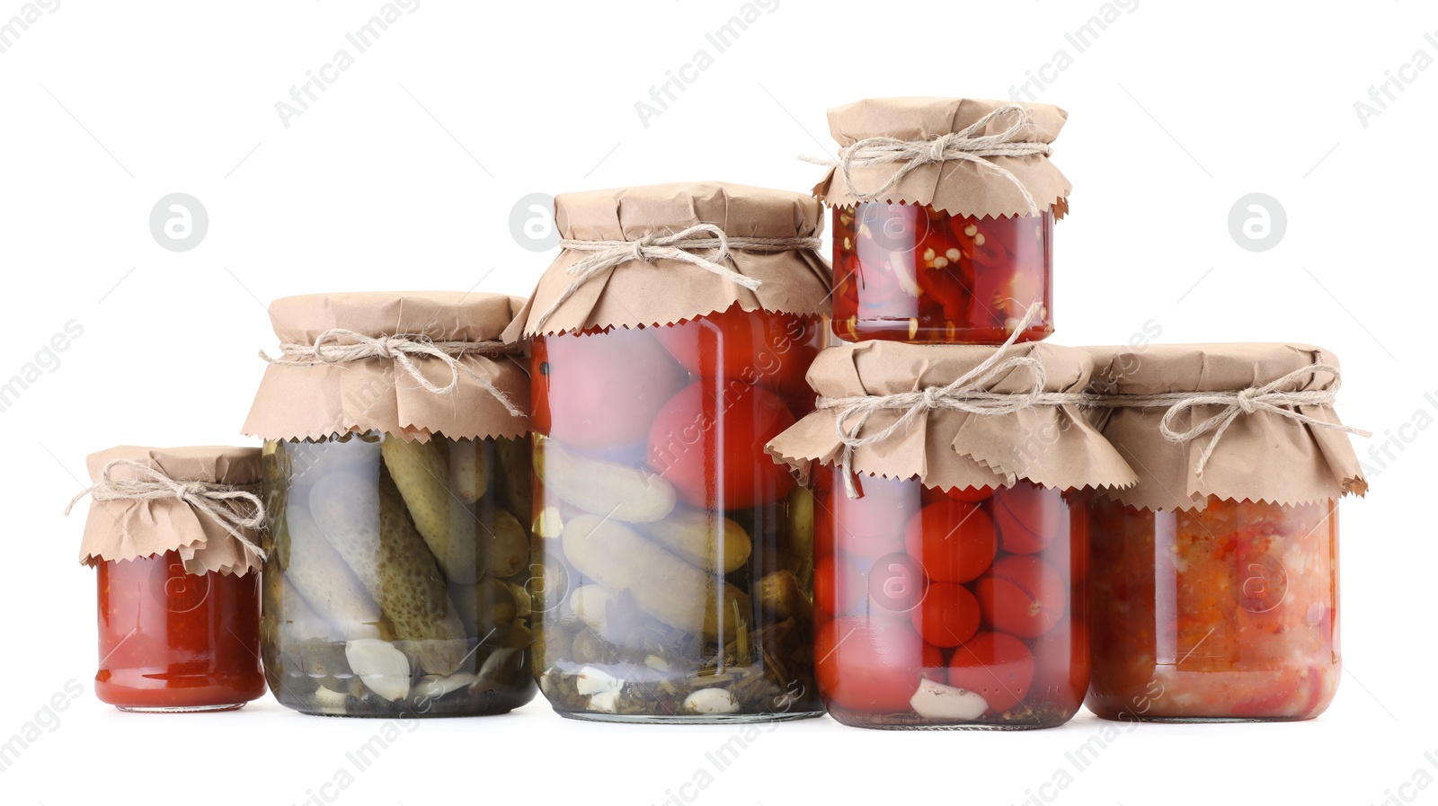 Many jars with different pickled products isolated on white Photo of Many jars with different pickled products isolated on white