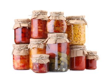 Photo of Many jars with different pickled products isolated on white