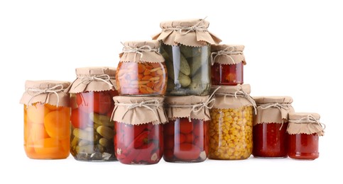 Photo of Many jars with different pickled products isolated on white