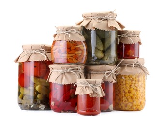Photo of Many jars with different pickled products isolated on white