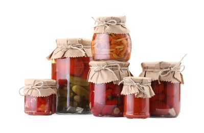 Photo of Many jars with different pickled products isolated on white