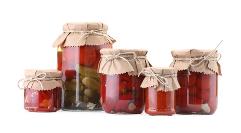 Photo of Many jars with different pickled products isolated on white