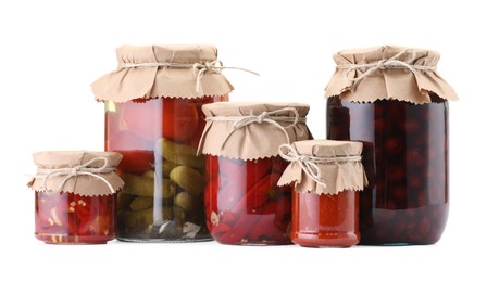 Photo of Many jars with different pickled products isolated on white