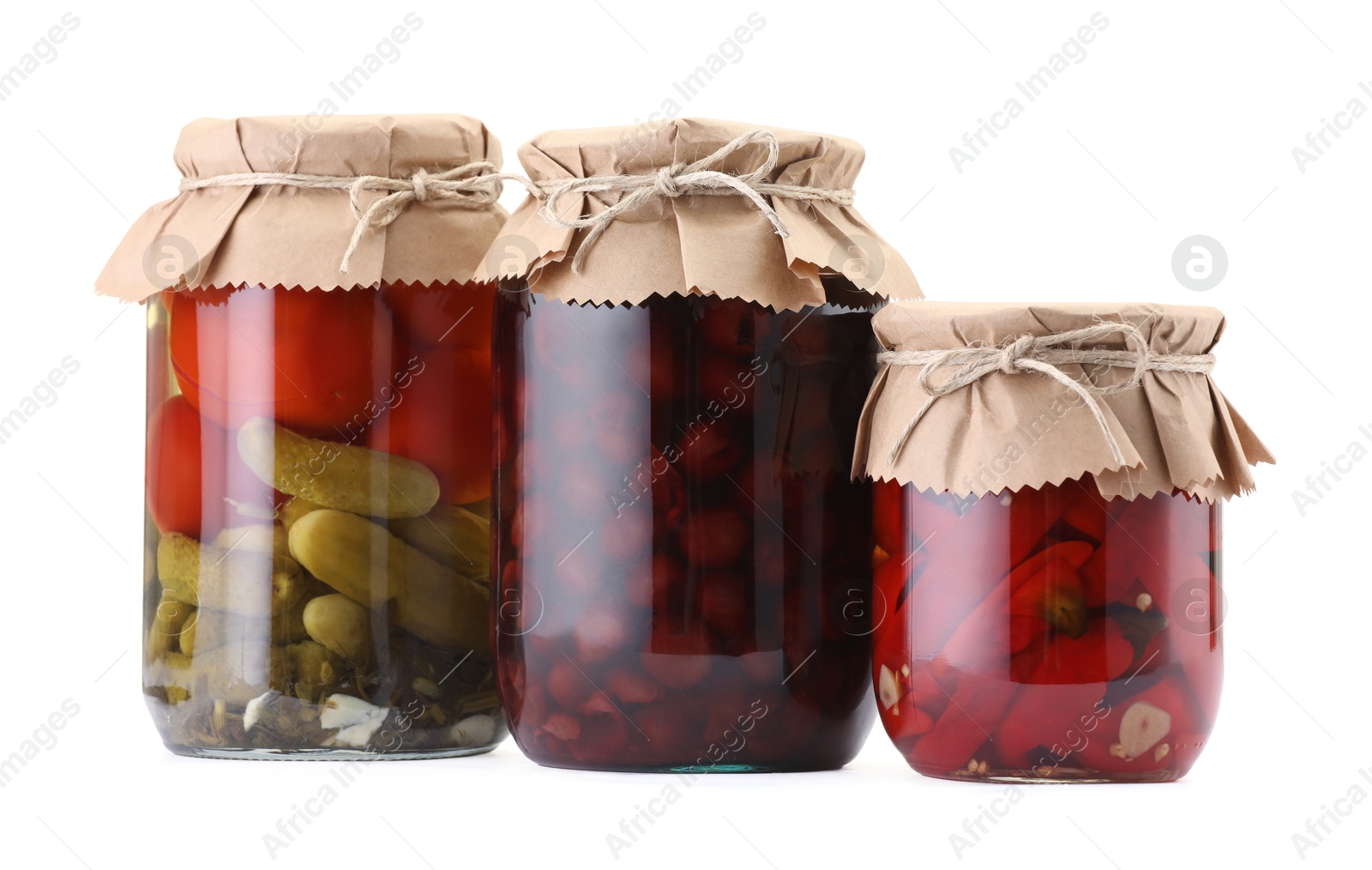 Jars with different pickled products isolated on white Photo of Jars with different pickled products isolated on white