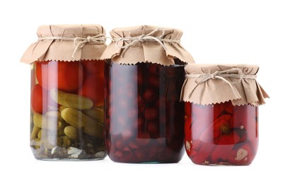 Photo of Jars with different pickled products isolated on white