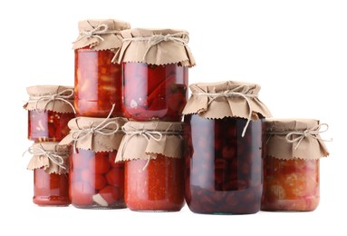 Photo of Many jars with different pickled products isolated on white