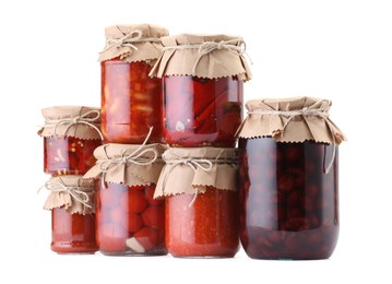 Photo of Many jars with different pickled products isolated on white