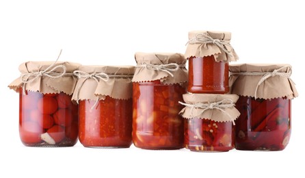 Photo of Many jars with different pickled products isolated on white