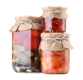 Photo of Jars with different pickled products isolated on white