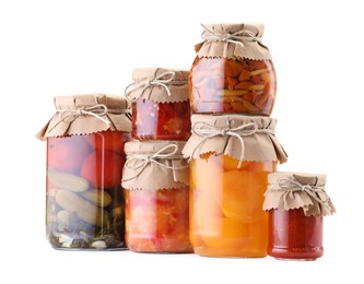 Photo of Many jars with different pickled products isolated on white