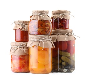 Photo of Many jars with different pickled products isolated on white