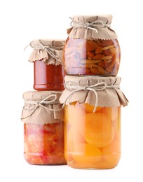 Photo of Many jars with different pickled products isolated on white