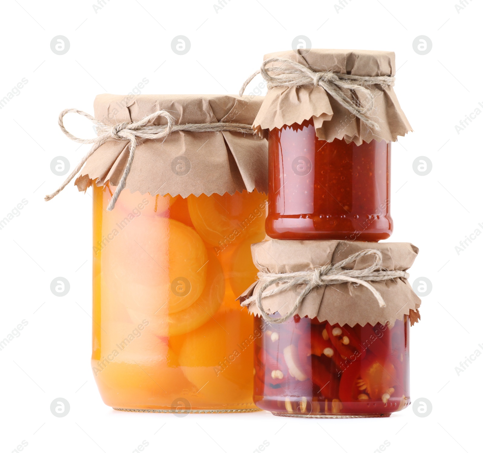 Jars with different pickled products isolated on white Photo of Jars with different pickled products isolated on white
