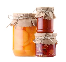 Photo of Jars with different pickled products isolated on white