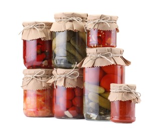 Photo of Many jars with different pickled products isolated on white