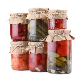 Photo of Many jars with different pickled products isolated on white