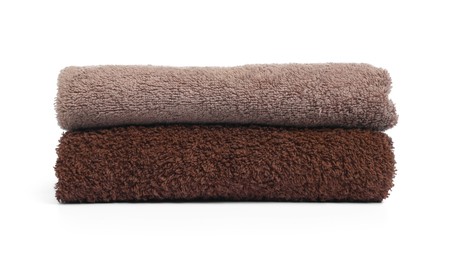 Photo of Two folded terry towels isolated on white