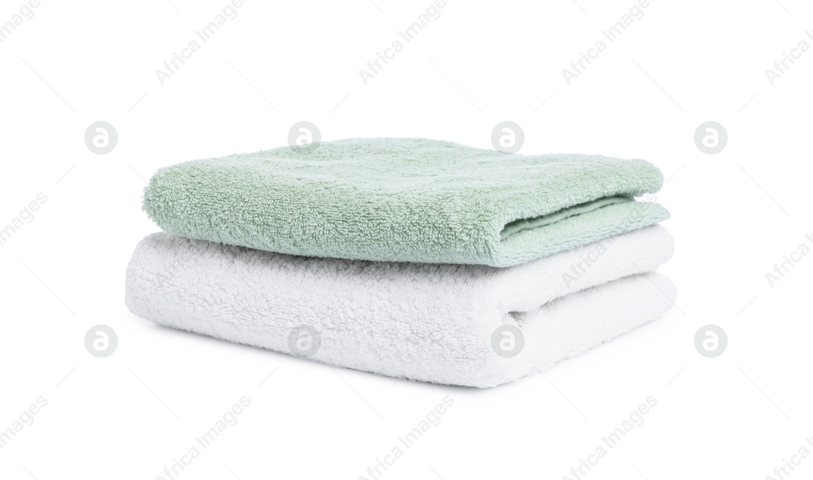 Two folded terry towels isolated on white Photo of Two folded terry towels isolated on white
