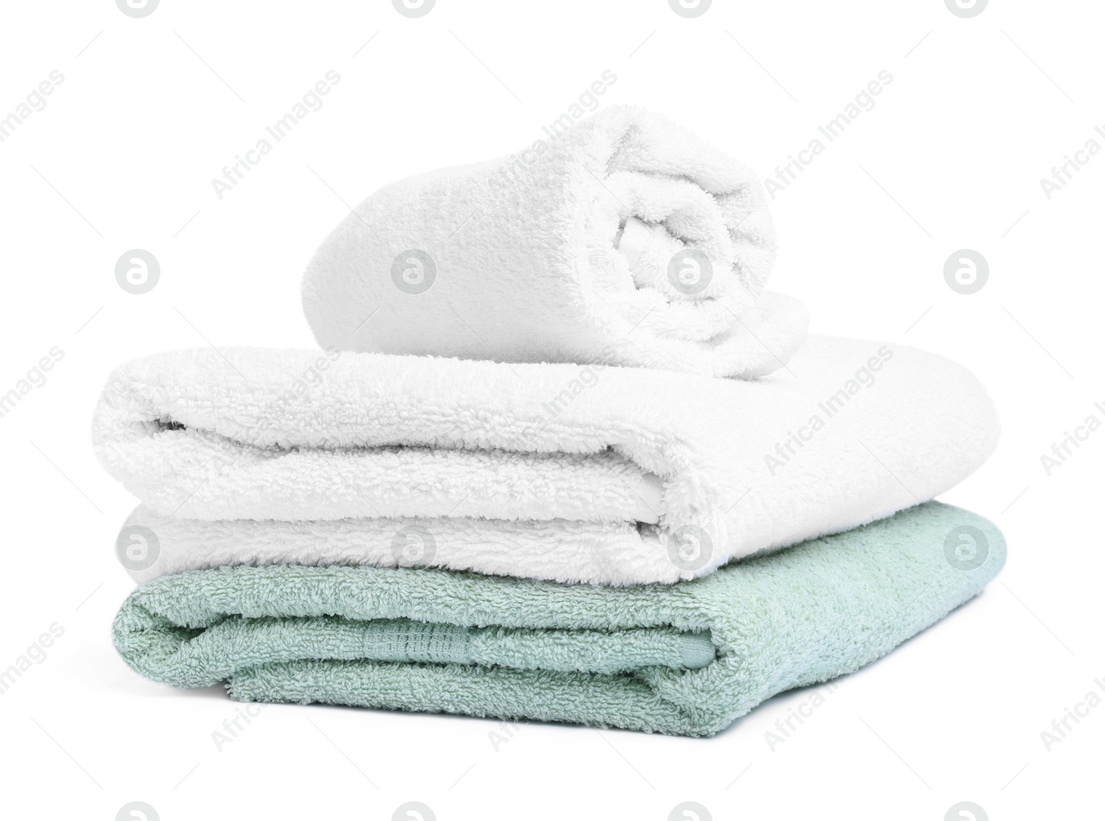 Many folded terry towels isolated on white Photo of Many folded terry towels isolated on white