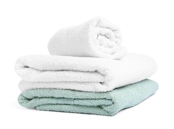 Photo of Many folded terry towels isolated on white